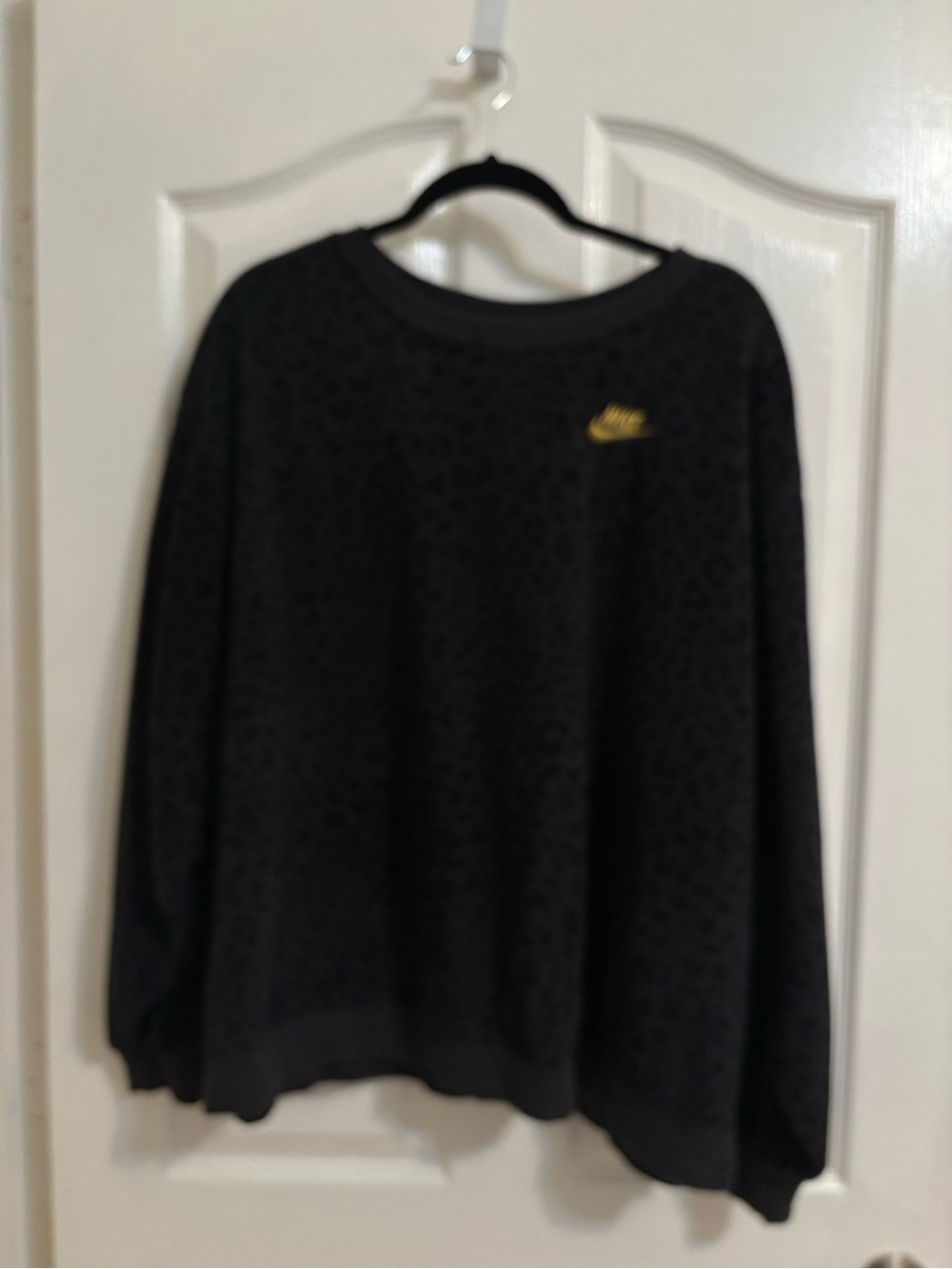 Nike Women's Black Crewneck Sweater with Gold Swoosh